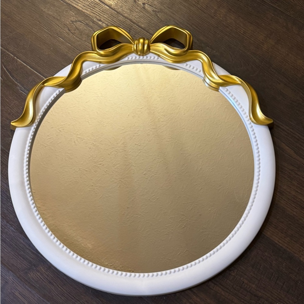 Elegant White and Gold Mirror with Bow Accent